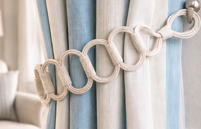 Laura Ashley Ardal Tieback on a blue and cream curtain